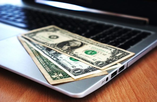 money on laptop